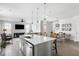 Spacious kitchen island with barstool seating, stainless steel appliances, and open to the living area at 46 Clearblue Loop, Summerville, SC 29486