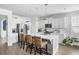 Modern kitchen featuring a large center island with counter seating and white cabinets at 46 Clearblue Loop, Summerville, SC 29486