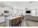 Open kitchen featuring an island with counter seating, pendant lighting, and modern appliances at 46 Clearblue Loop, Summerville, SC 29486
