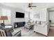 Bright living room featuring a ceiling fan, a large sofa, and stylish decor at 46 Clearblue Loop, Summerville, SC 29486