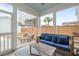 Cozy screened porch with wicker furniture, blue cushions, and view of backyard at 46 Clearblue Loop, Summerville, SC 29486