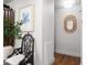 Hallway featuring modern decor, hardwood floors, and decorative artwork at 461 Double Eagle Trce, Johns Island, SC 29455