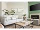 Bright and airy living room featuring a cozy seating area with a fireplace and modern decor at 4993 Lake Palmetto, North Charleston, SC 29418