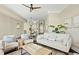 Inviting living room with neutral decor, comfortable seating, and modern ceiling fan at 4993 Lake Palmetto, North Charleston, SC 29418