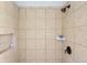 Shower featuring neutral tiles, sleek fixtures, and built-in shelving at 4993 Lake Palmetto, North Charleston, SC 29418