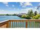 Balcony view of waterfront property with lush greenery and clear blue skies at 4993 Lake Palmetto, North Charleston, SC 29418