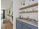 Bar area with open shelves and stylish white and gold decor at 500 Eagleview Dr, Moncks Corner, SC 29461