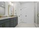 Modern bathroom with double vanity, gold fixtures, and glass-enclosed shower at 500 Eagleview Dr, Moncks Corner, SC 29461