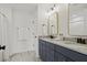 Modern bathroom featuring double vanity with marble countertop and gold framed mirrors at 500 Eagleview Dr, Moncks Corner, SC 29461