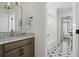 Bright bathroom boasting patterned tile flooring, stylish vanity, and open access to the shower at 500 Eagleview Dr, Moncks Corner, SC 29461