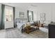 Bright bedroom featuring a black metal bed frame, stylish rug, and neutral-toned decor at 500 Eagleview Dr, Moncks Corner, SC 29461