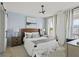 Comfortable bedroom with accent wall, patterned rug, and abundant natural light at 500 Eagleview Dr, Moncks Corner, SC 29461