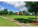 Scenic neighborhood green with sidewalk and colorful homes in the background at 500 Eagleview Dr, Moncks Corner, SC 29461