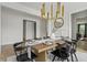 Stunning dining room featuring hardwood floors, stylish lighting, and a modern decor aesthetic at 500 Eagleview Dr, Moncks Corner, SC 29461
