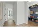 Hallway with hardwood floors featuring a mudroom and open doorway into the living area at 500 Eagleview Dr, Moncks Corner, SC 29461