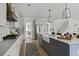 Modern kitchen with stainless steel appliances, large island, and hardwood floors at 500 Eagleview Dr, Moncks Corner, SC 29461