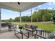Inviting screened porch featuring outdoor furniture and a view of the lush backyard at 500 Eagleview Dr, Moncks Corner, SC 29461