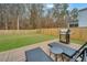 A spacious backyard features a wood deck, lounge chairs, grill, lawn and fenced perimeter at 500 Minim St, Charleston, SC 29414