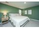 This bedroom has green walls, carpet, and a king bed at 500 Minim St, Charleston, SC 29414
