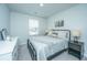 Charming bedroom featuring neutral decor, soft lighting, and a view of the outdoors at 500 Minim St, Charleston, SC 29414