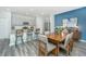 Modern dining area with wood table, seating, and view of the kitchen, complete with granite countertops at 500 Minim St, Charleston, SC 29414