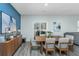 A well-lit dining room with stylish wood table and chairs, complemented by modern decor and wood floors at 500 Minim St, Charleston, SC 29414