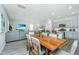 Open dining area featuring wood floors, adjacent to a modern kitchen and cozy living space at 500 Minim St, Charleston, SC 29414