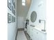 Hallway entry with decor, and shoe cabinet with neutral toned wood flooring at 500 Minim St, Charleston, SC 29414