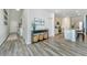 Open-concept entryway with hallway and kitchen and neutral-toned wood flooring at 500 Minim St, Charleston, SC 29414