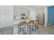 Bright kitchen with gray cabinets, stainless steel appliances, and granite countertops at 500 Minim St, Charleston, SC 29414