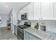 Kitchen features stainless steel appliances, granite countertops, gray lower and white upper cabinets at 500 Minim St, Charleston, SC 29414