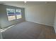 Bright bedroom featuring neutral carpet, a large window, and abundant natural light at 5032 Scow Ct, Summerville, SC 29485