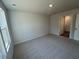 Cozy bedroom with neutral carpet, and a sun-filled window at 5032 Scow Ct, Summerville, SC 29485