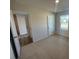 Sunlit bedroom with a large window and a connecting door into the hall at 5032 Scow Ct, Summerville, SC 29485