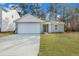 Charming single-Gathering home featuring a two-car garage and a well-maintained front lawn at 5032 Scow Ct, Summerville, SC 29485