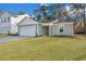 Charming single-Gathering home featuring a two-car garage and a well-maintained front lawn at 5032 Scow Ct, Summerville, SC 29485