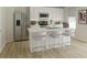 Charming kitchen featuring stainless steel appliances, white cabinetry, and quartz countertops at 5032 Scow Ct, Summerville, SC 29485