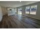 Open-concept living space featuring wood-look floors and connecting to the kitchen at 5032 Scow Ct, Summerville, SC 29485