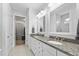 Bright bathroom features a granite countertop and ample cabinet space beneath double sinks at 550 Tidewater Chase Ln, Summerville, SC 29486