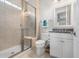 Bathroom features a glass enclosed shower, single vanity with granite countertop, and white cabinet at 550 Tidewater Chase Ln, Summerville, SC 29486