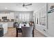 Elegant dining room featuring modern furnishings and abundant natural light from shuttered windows at 550 Tidewater Chase Ln, Summerville, SC 29486
