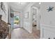 Bright entryway showcasing beautiful floors and views into the home at 550 Tidewater Chase Ln, Summerville, SC 29486