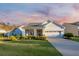 Charming single-story home features a well-manicured lawn and inviting front porch at 550 Tidewater Chase Ln, Summerville, SC 29486