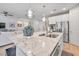 Open kitchen design featuring a center island with marble countertops overlooking a comfortable living space at 550 Tidewater Chase Ln, Summerville, SC 29486