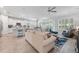Open-concept living room with a ceiling fan, comfortable seating, and stylish decor at 550 Tidewater Chase Ln, Summerville, SC 29486