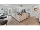 Bright and airy living room with neutral decor, hardwood floors, and sliding glass doors to outdoor seating at 550 Tidewater Chase Ln, Summerville, SC 29486