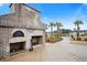 Brick outdoor kitchen and fireplace located next to walking path and pond at 550 Tidewater Chase Ln, Summerville, SC 29486