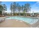 A clear pool shows plenty of seating with several lounge chairs and a view of the tree line at 550 Tidewater Chase Ln, Summerville, SC 29486