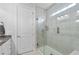 This bathroom features a glass enclosed tiled shower, small window and tiled flooring at 550 Tidewater Chase Ln, Summerville, SC 29486