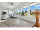 Bright sunroom with multiple windows, blinds, ceiling fan and wood-look floors at 550 Tidewater Chase Ln, Summerville, SC 29486